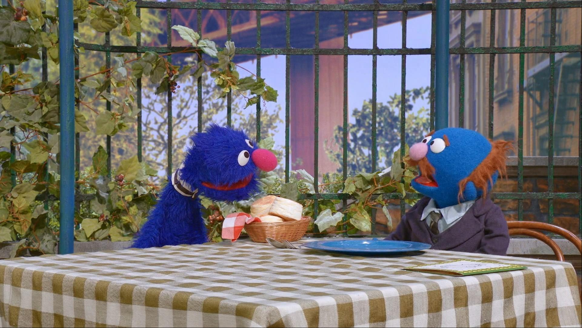 Grover and his friend, the octopus, are helping at Hooper’s Store.