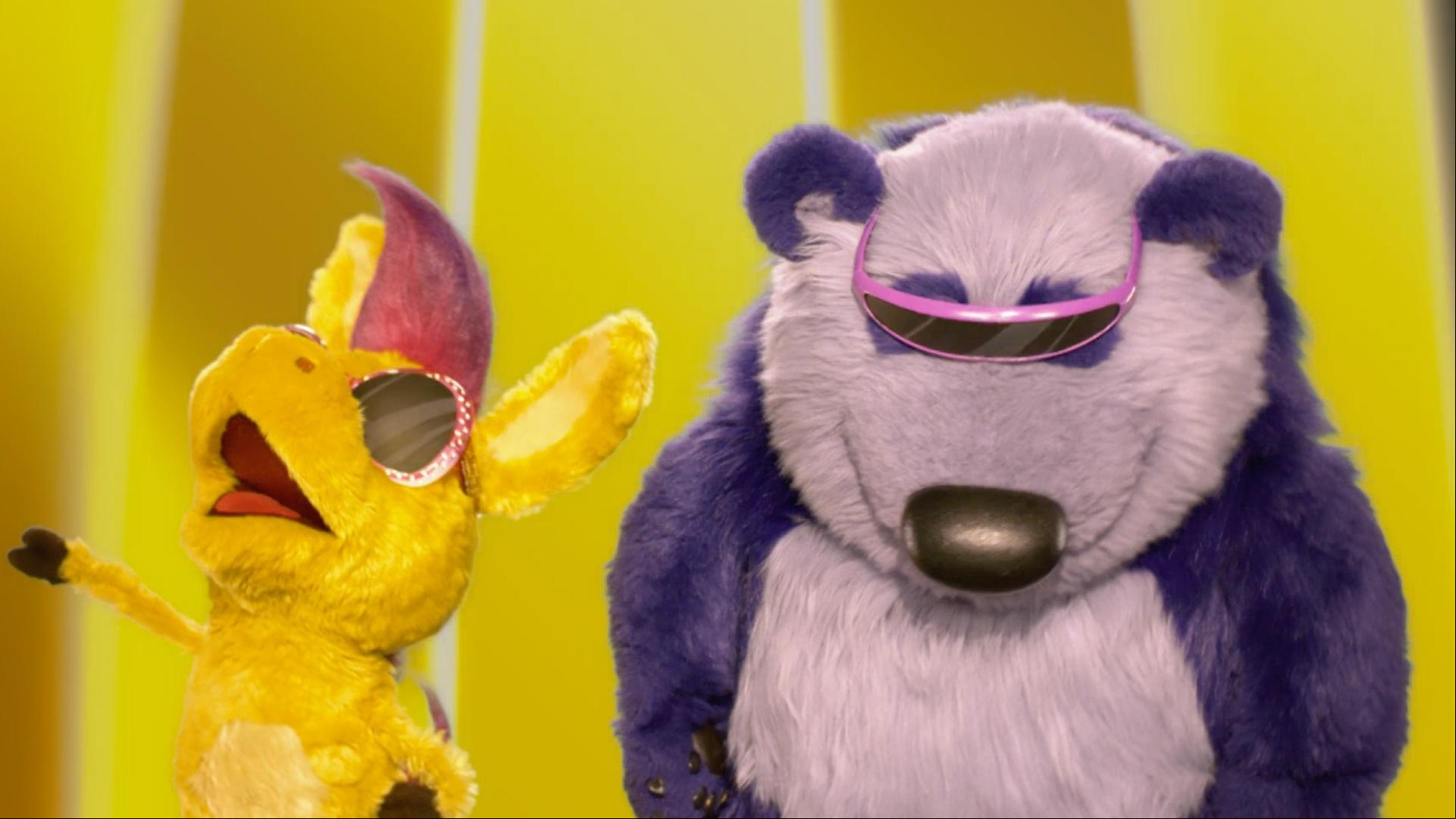 Donkey and Panda dance under a golden rainbow on their quest for Golden Crunchdoodles.