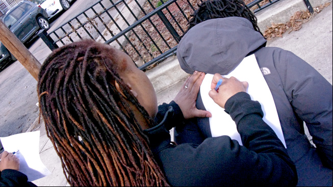 Mark handout on girl's back