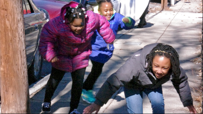 Three girls dodge sun