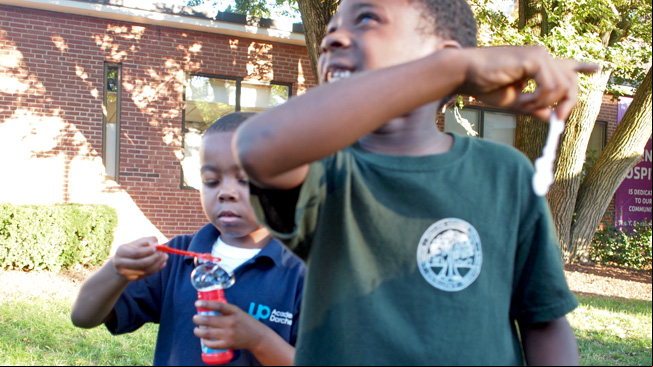 Boys playing with bubbles